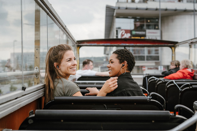 Two women sitting on a double-decker bus in Kiel