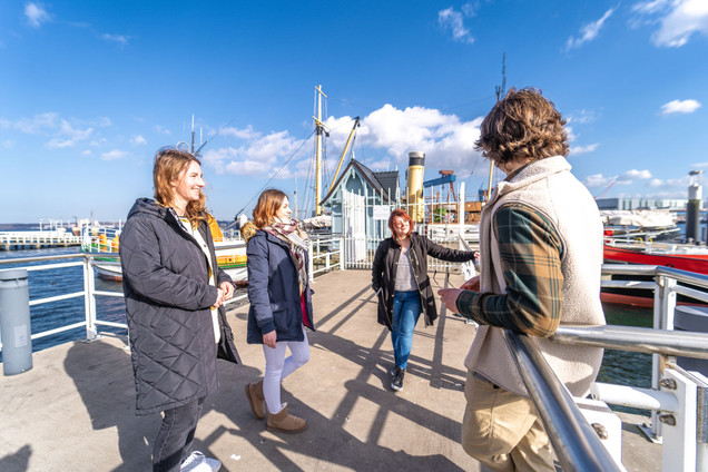 Tourist group on a tour on the Kiel harbour